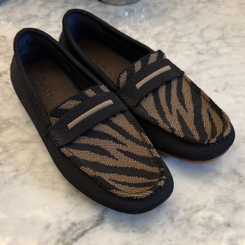 Rothy's Black and Brown Zebra-Patterned Flats